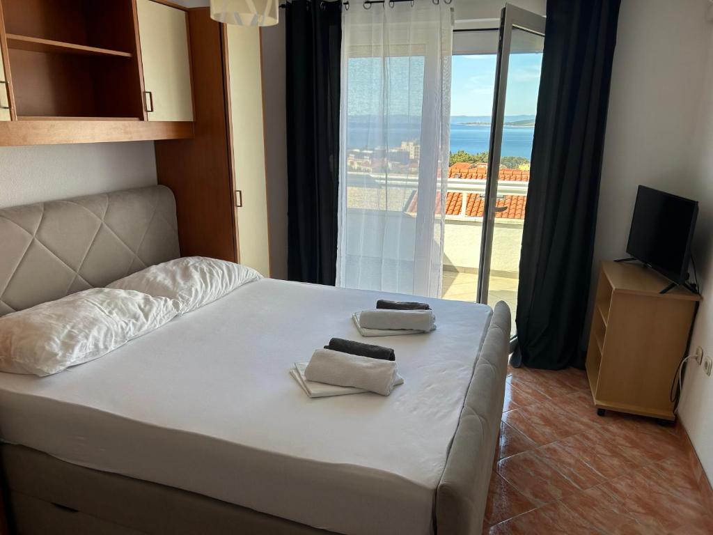 Postel nebo postele na pokoji v ubytování Apartmani Jukanovic