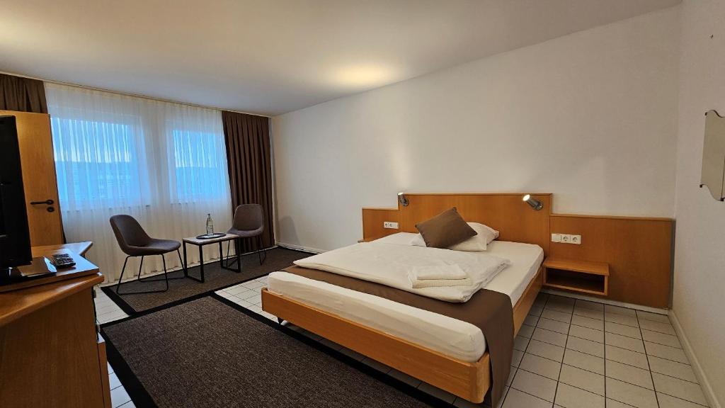 Postel nebo postele na pokoji v ubytování Elha Hotel