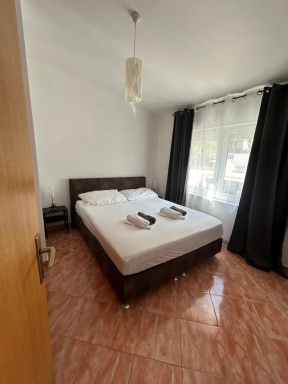 Postel nebo postele na pokoji v ubytování Apartmani Jukanovic