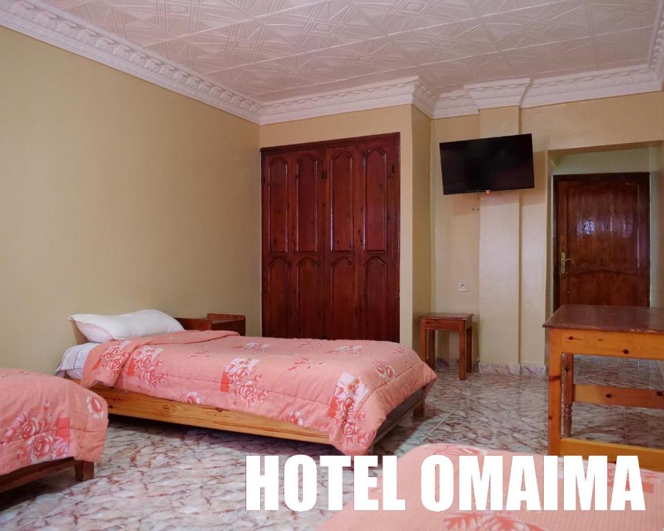 Letto o letti in una camera di Hotel OMAIMA