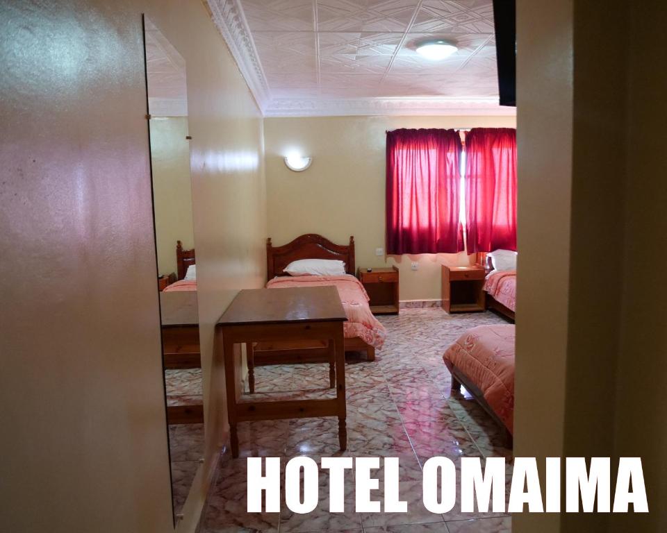 Letto o letti in una camera di Hotel OMAIMA