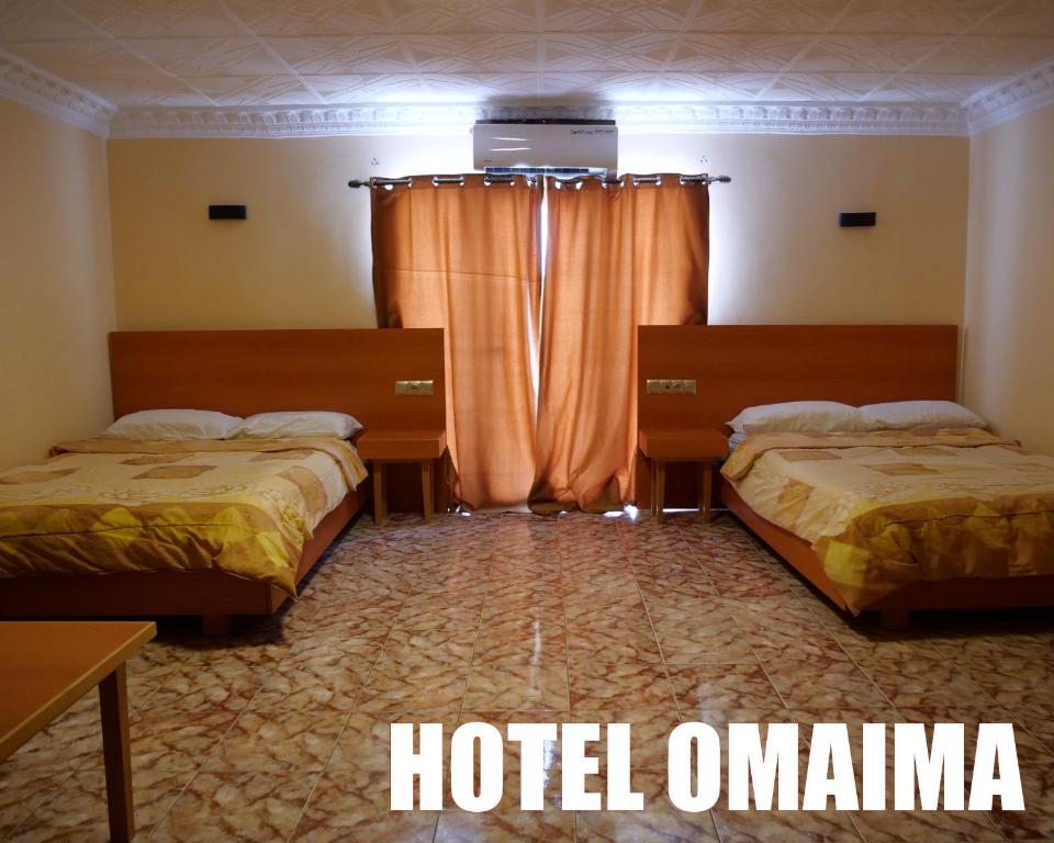 Letto o letti in una camera di Hotel OMAIMA