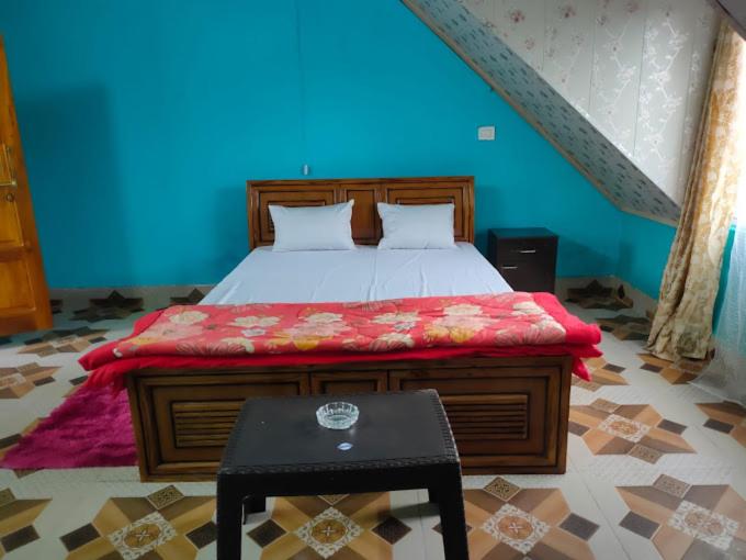 Postel nebo postele na pokoji v ubytování LEPCHA'S ETHNIC HOMESTAY Kalimpong, kanchenjunga View, Near Morgan House