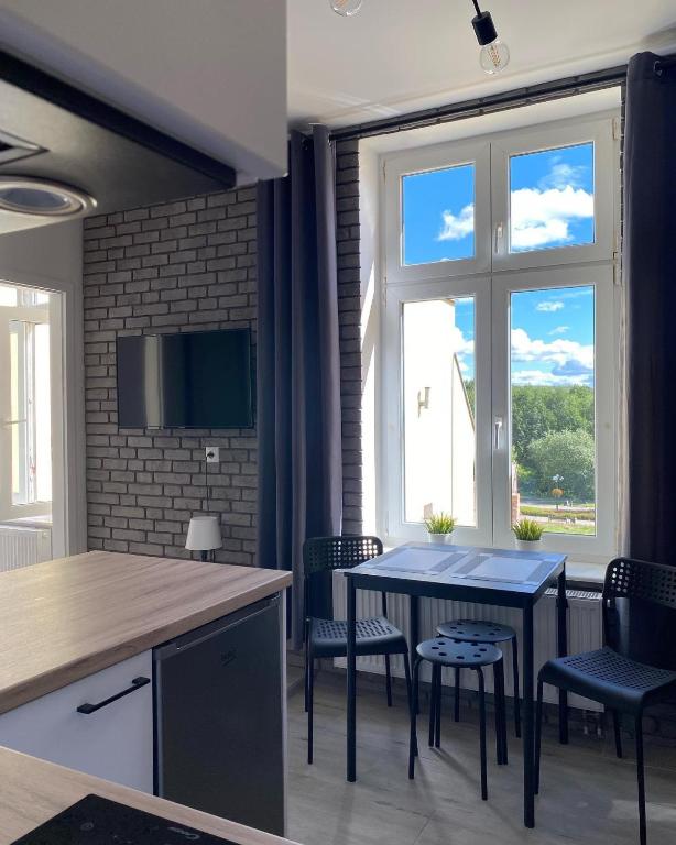 Televízia a/alebo spoločenská miestnosť v ubytovaní Apartamenty "CENTRUM" Mrągowo Mazury