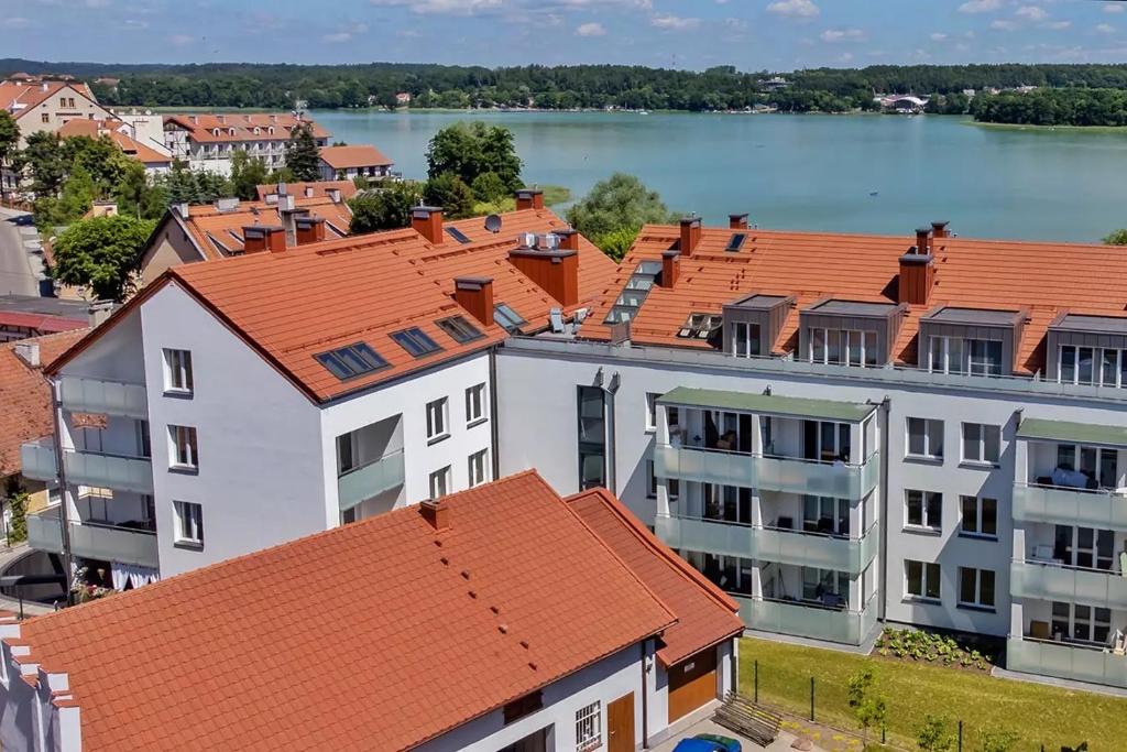 an overhead view of buildings with orange roofs at Apartament "CZOS" Mrągowo Mazury in Mrągowo