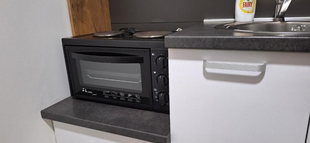 Kuchyň nebo kuchyňský kout v ubytování S-Apartmani Cocetova