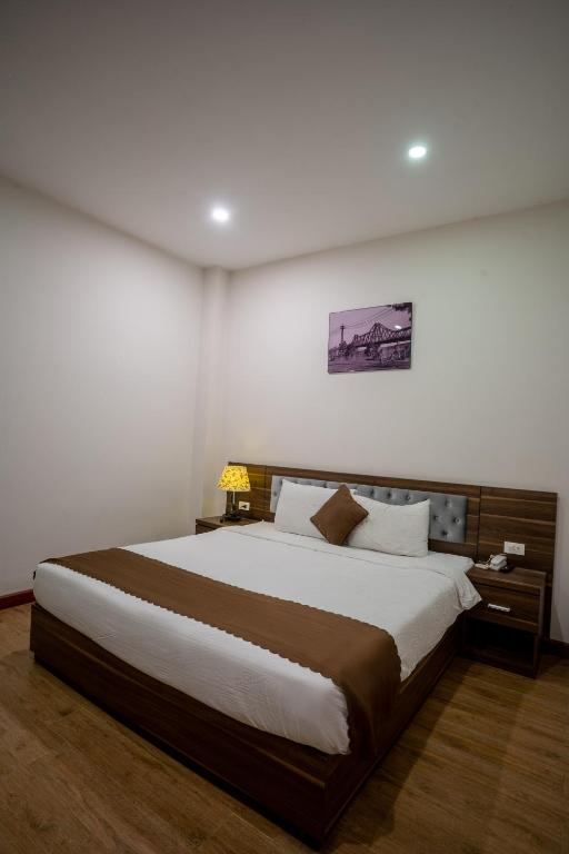 Giường trong phòng chung tại Mai Khanh Hotel