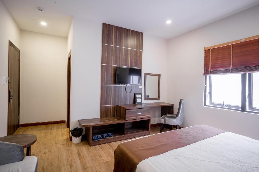 Giường trong phòng chung tại Mai Khanh Hotel