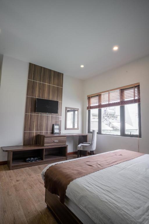 Giường trong phòng chung tại Mai Khanh Hotel