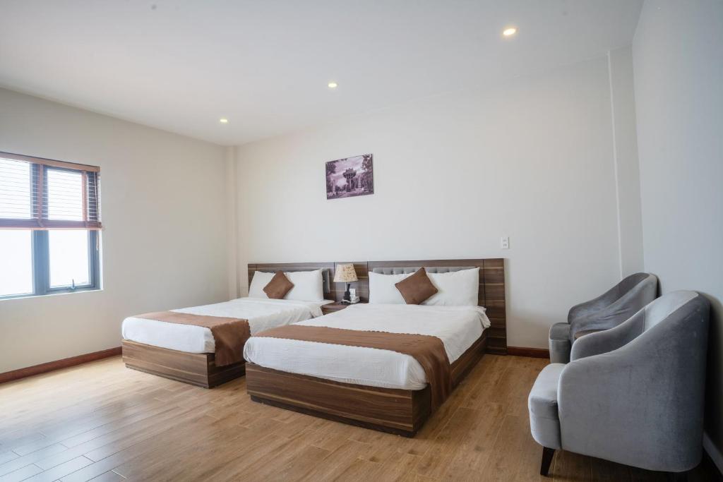 Giường trong phòng chung tại Mai Khanh Hotel