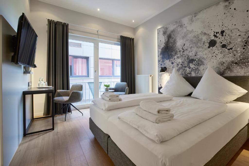 Postel nebo postele na pokoji v ubytování Hotel Soho