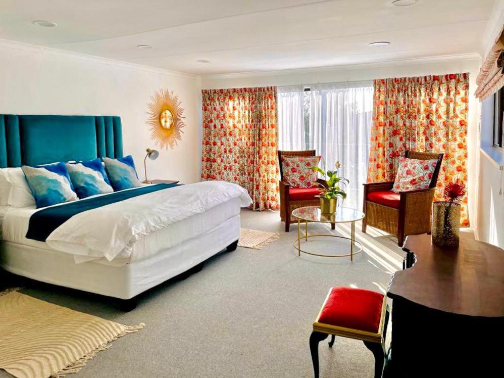 Postel nebo postele na pokoji v ubytování Hibiscus House