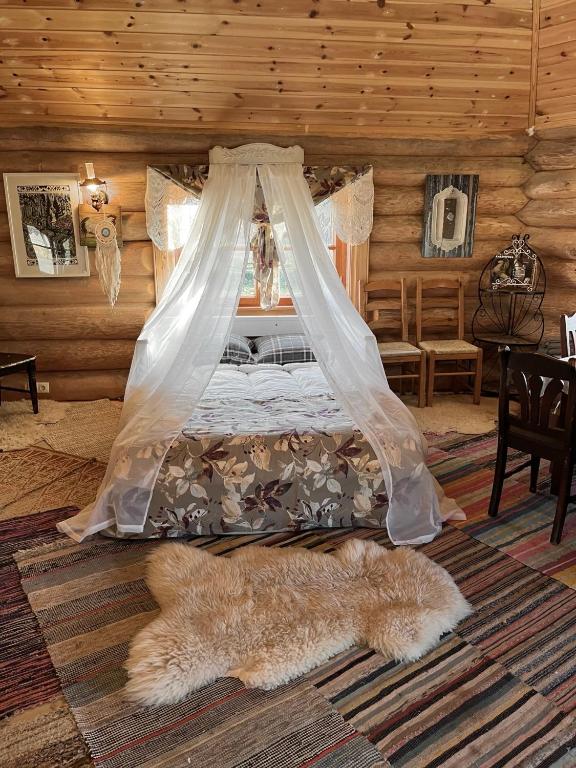 Postel nebo postele na pokoji v ubytování Tagavälja talu Cottage and Sauna on a farm B&B, rural experience