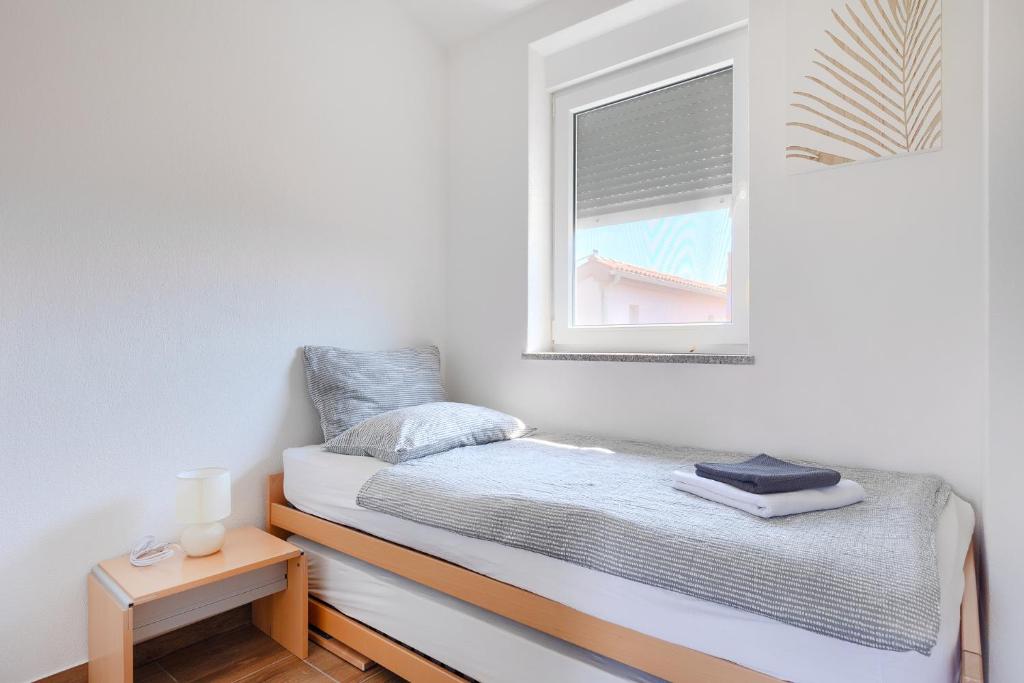 Postel nebo postele na pokoji v ubytování Villa Lara 2