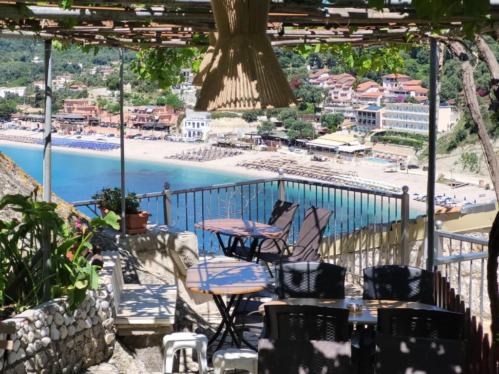 a balcony with chairs and a view of the beach at Paraskevi's Luxury Studios in Parga