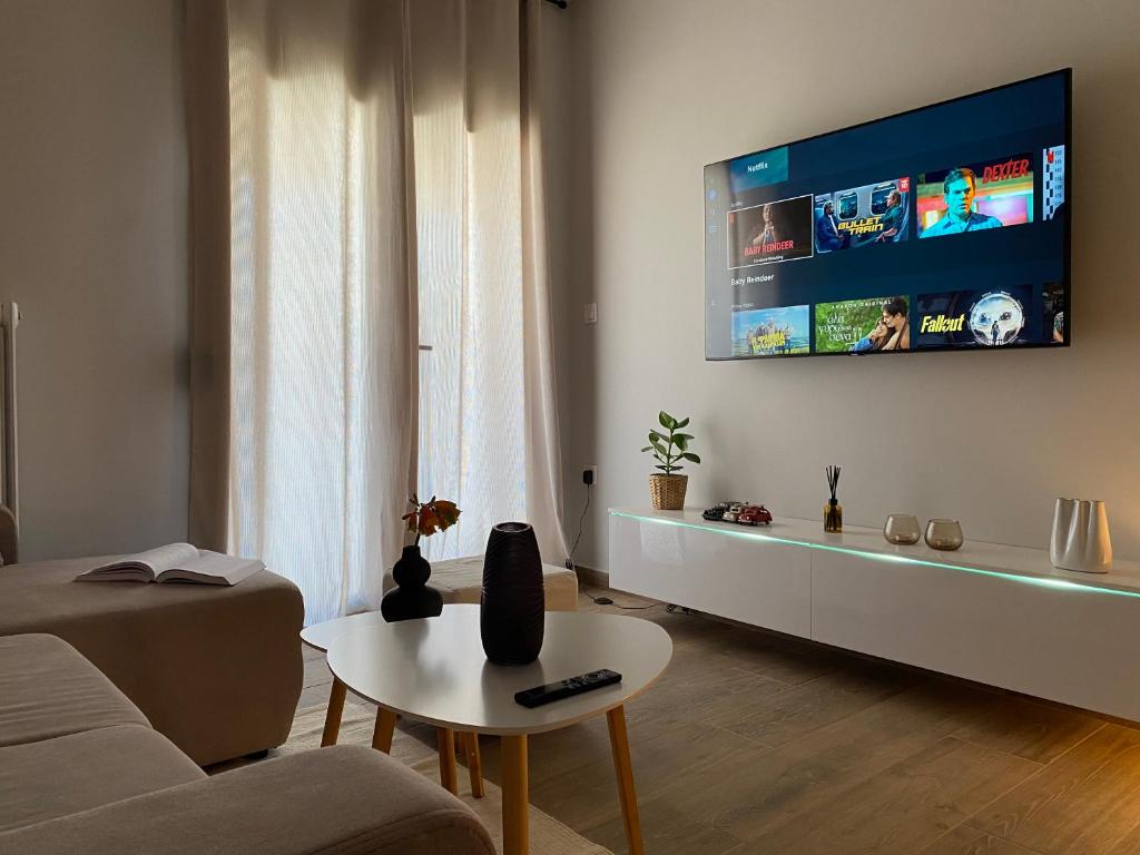 A television and/or entertainment centre at West Comfort - near Agia Marina metro