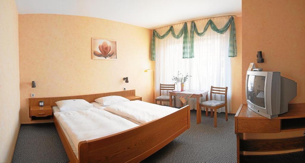 Postel nebo postele na pokoji v ubytování Pension Keinath