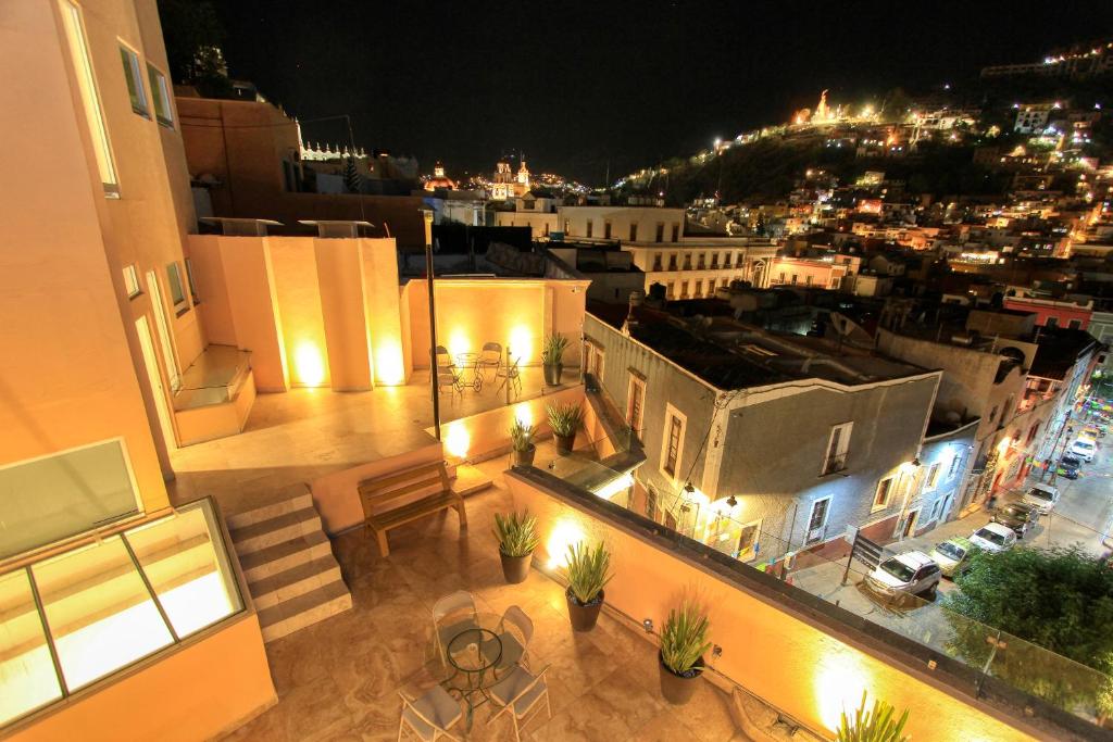 a view of a balcony of a building at night at Hotel Grand Guanajuato in Guanajuato