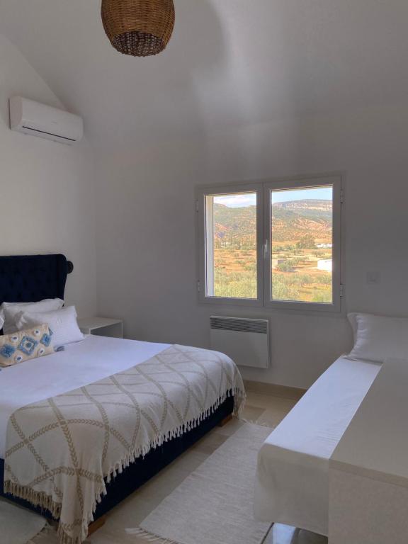 Postel nebo postele na pokoji v ubytování Villa a la montagne Hammamet