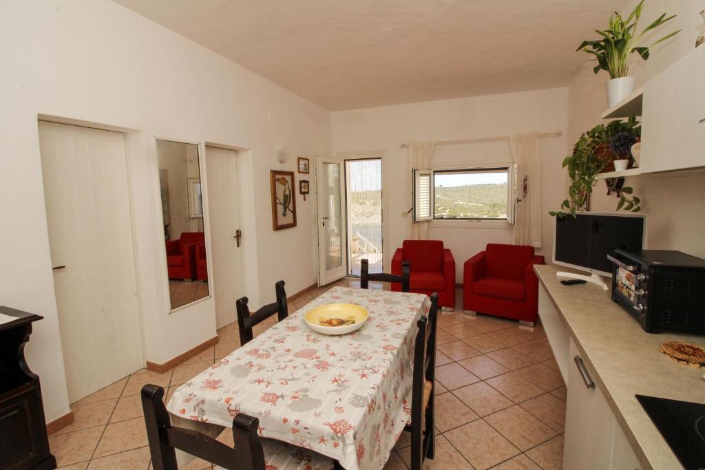 Kuchyň nebo kuchyňský kout v ubytování Villaggio polifemo 38 Località Cala Sapone