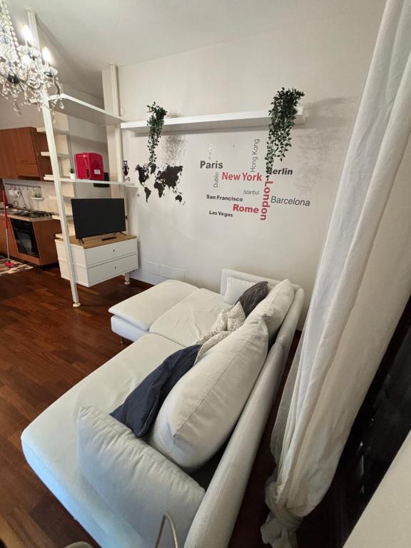 a room with a bed in a room with a wall at Michelangelo Apartment Pescara in Pescara