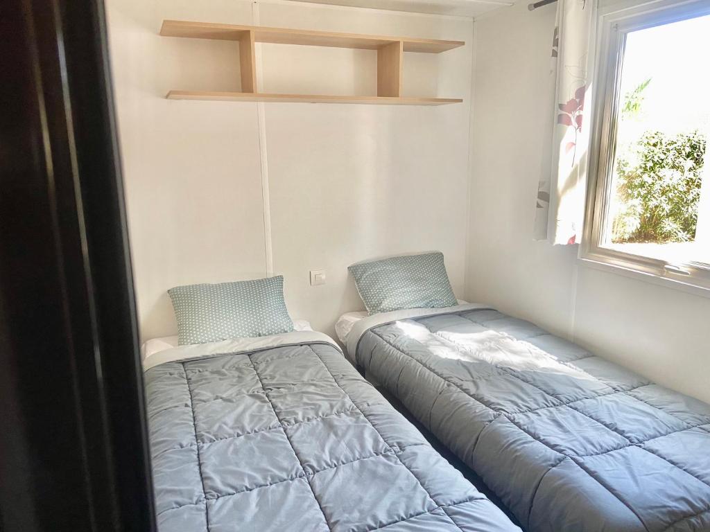 Postel nebo postele na pokoji v ubytování Tiny House, Mobilhome 6 personnes au Port de Vendres plage