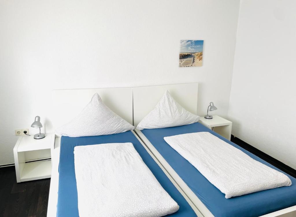 Postel nebo postele na pokoji v ubytování hausamhafen Bremerhaven Geestland