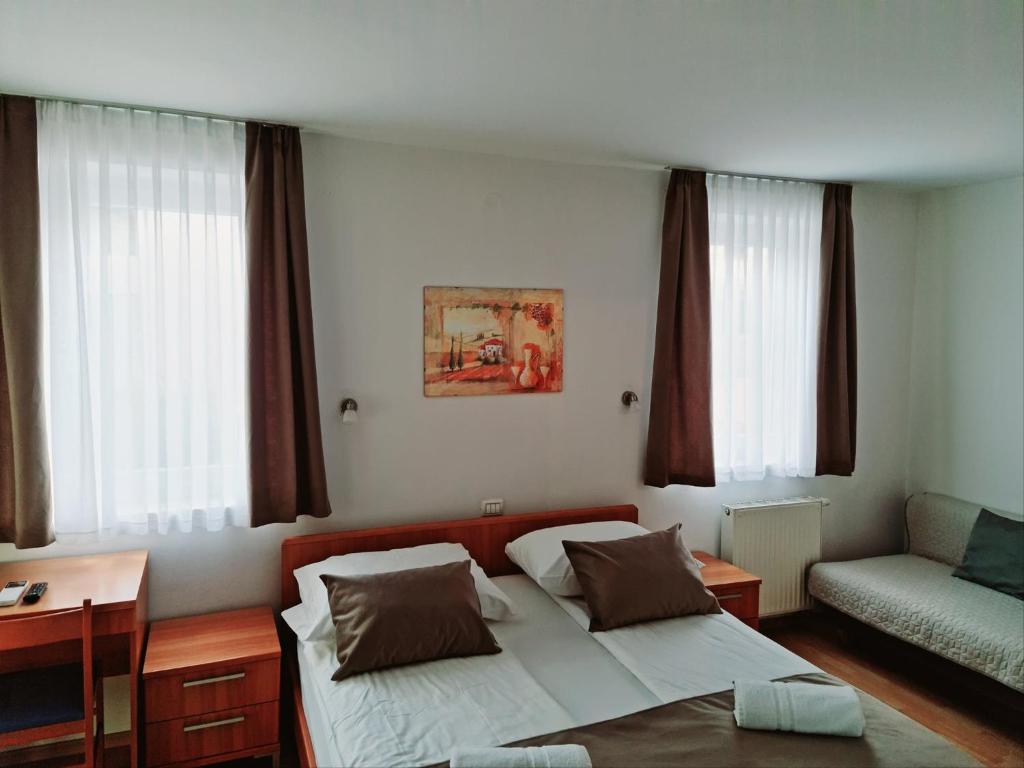 Postel nebo postele na pokoji v ubytování Garni Hotel Keltika