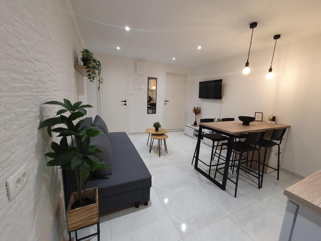a living room with a couch and a table at Vacation Liberation Apartment in Split