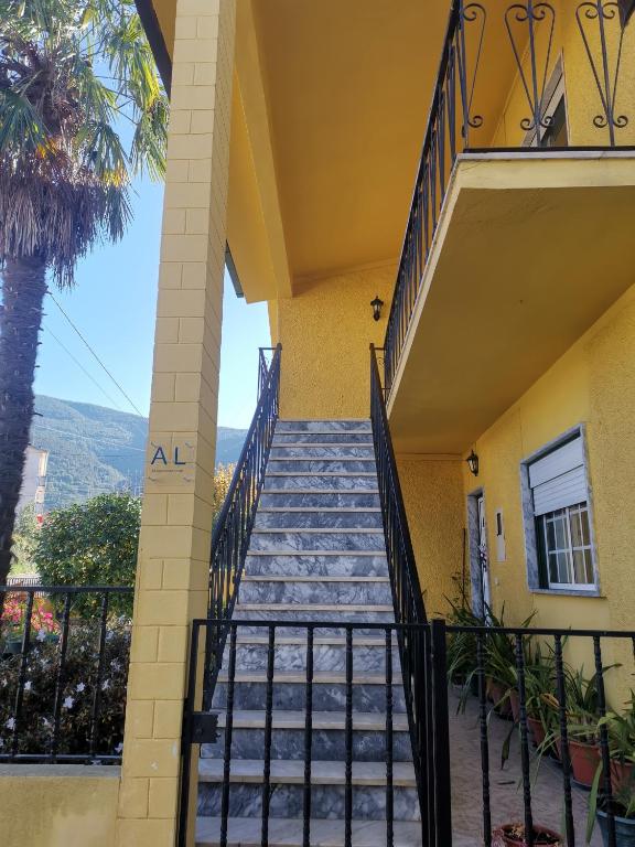 a staircase leading up to a house with a palm tree at Moradia Coelho in Lousã