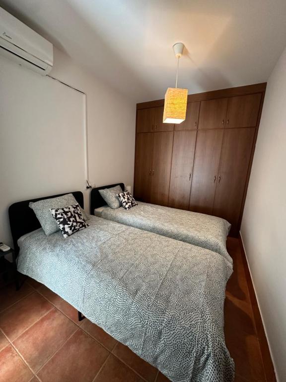 Postel nebo postele na pokoji v ubytování Casita del Barranco lunar