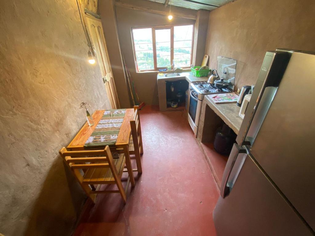 Kuchyň nebo kuchyňský kout v ubytování Wallpari Sonqo Hospedaje Medicina temazcal