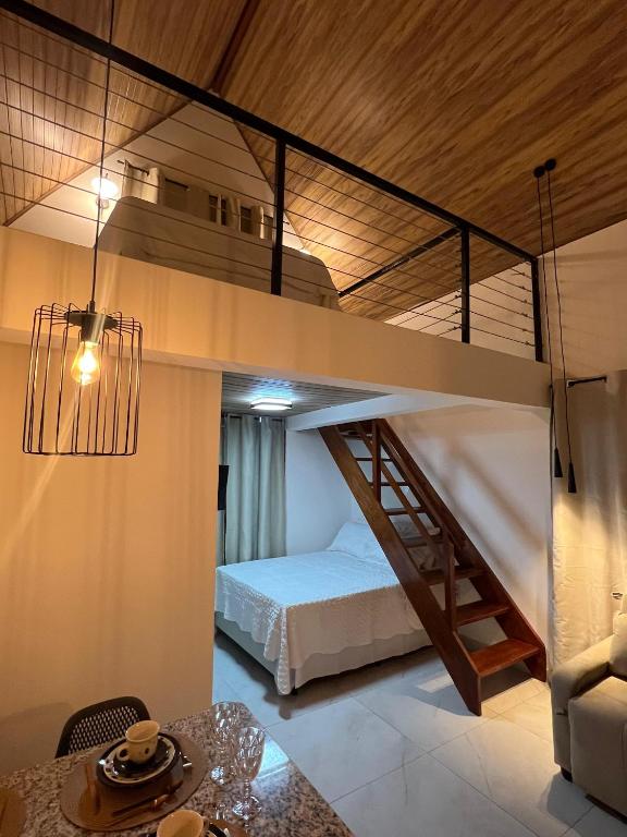 a bedroom with a bunk bed in a room at Loft Serra Chalés in Serra de São Bento