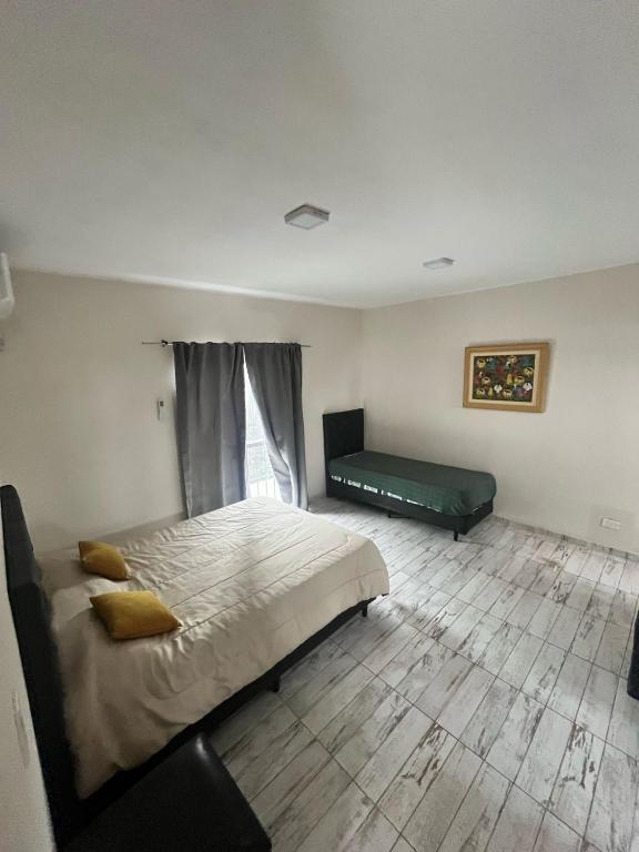 Postel nebo postele na pokoji v ubytování Tempo Suites