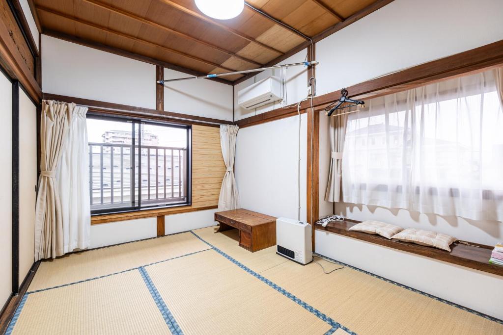 Postel nebo postele na pokoji v ubytování Hostel みんか松本