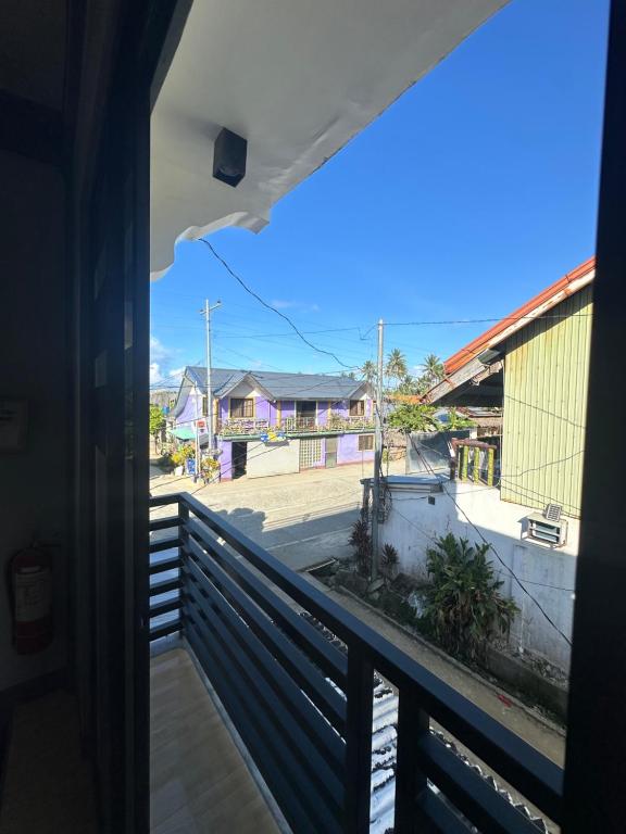 a view of a street from a balcony at MG Homestay in Burgos