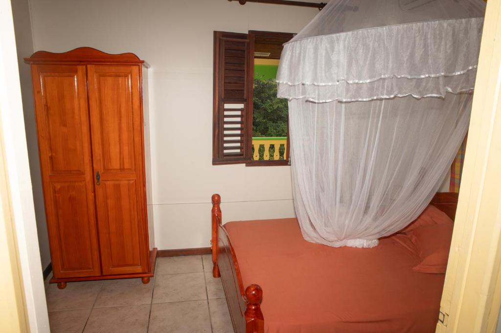 Postel nebo postele na pokoji v ubytování Le gîte du jardin