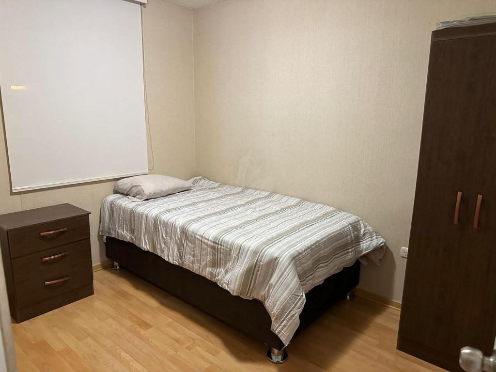 מיטה או מיטות בחדר ב-APARTAMENTO EN ICA