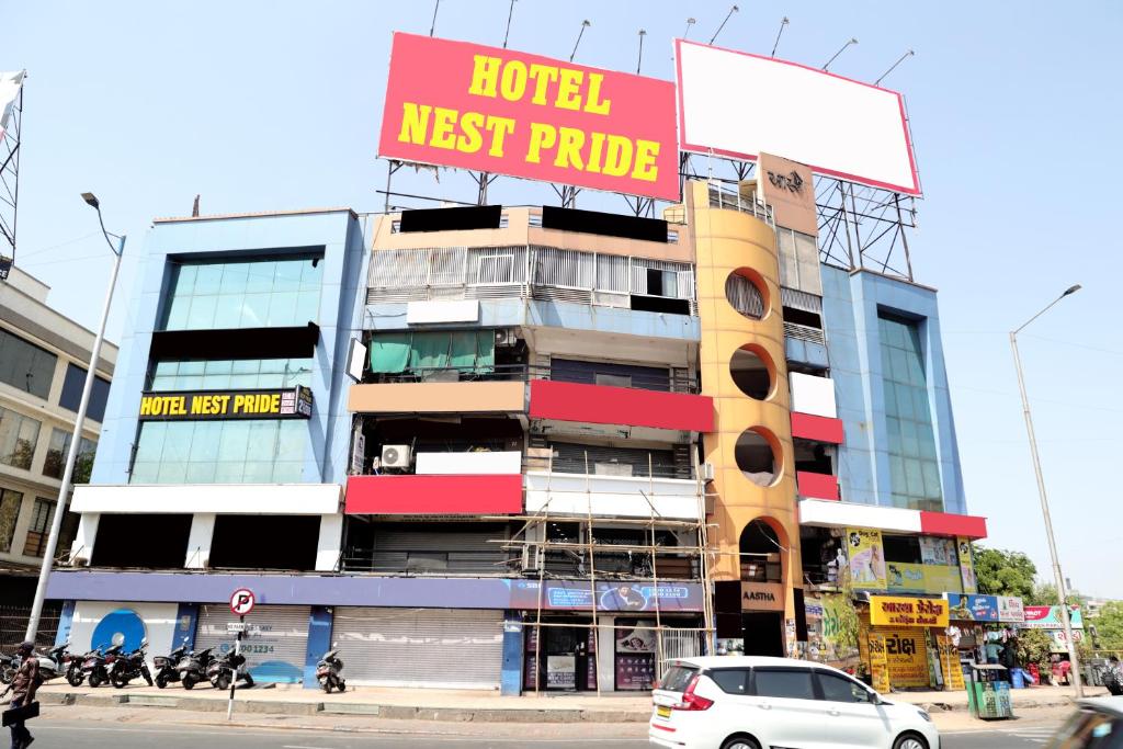 a building with a hotel next pride sign on it at Hotel Nest pride in Ahmedabad