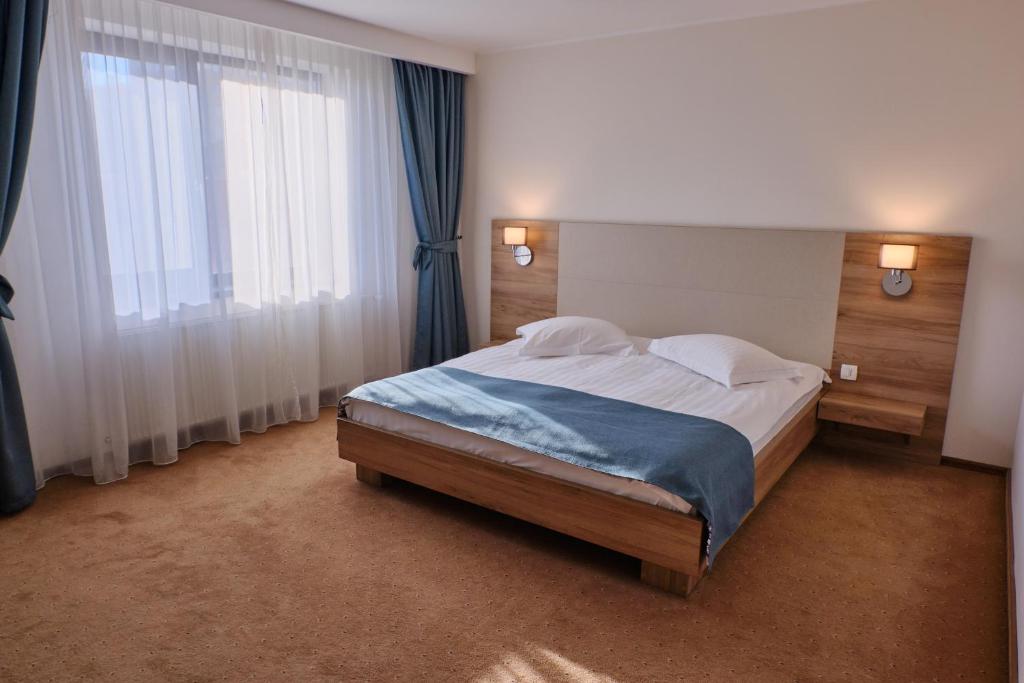 Postel nebo postele na pokoji v ubytování Hotel Regal