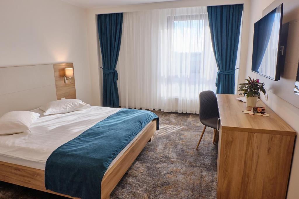 Postel nebo postele na pokoji v ubytování Hotel Regal