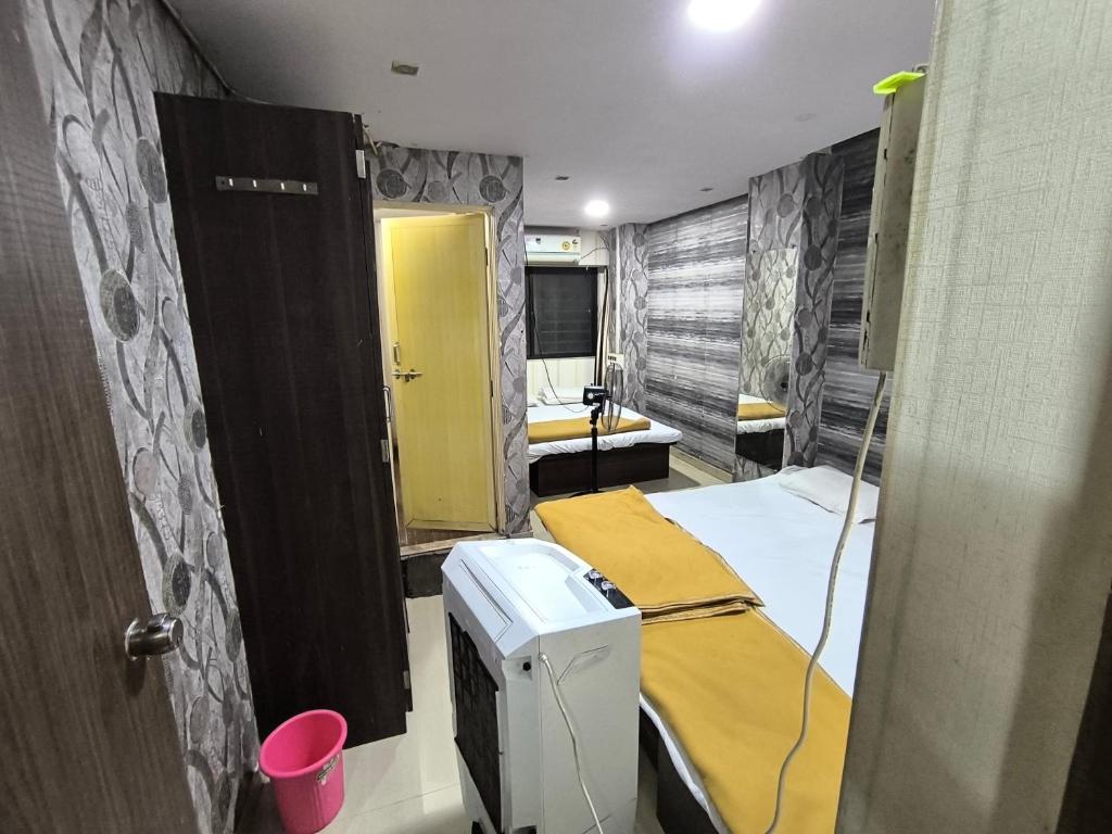 Katil atau katil-katil dalam bilik di Hotel Swarajya