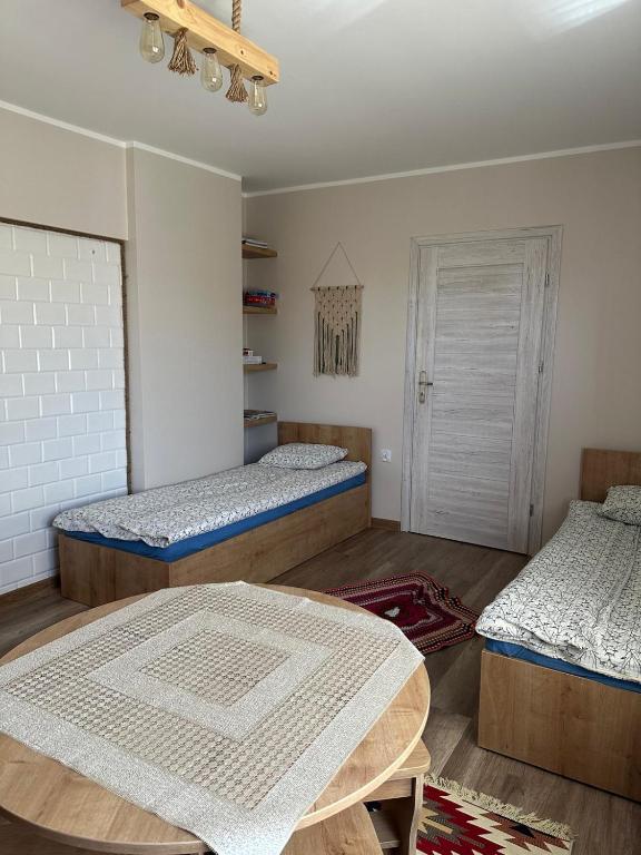 Postel nebo postele na pokoji v ubytování Krok od Biebrzy