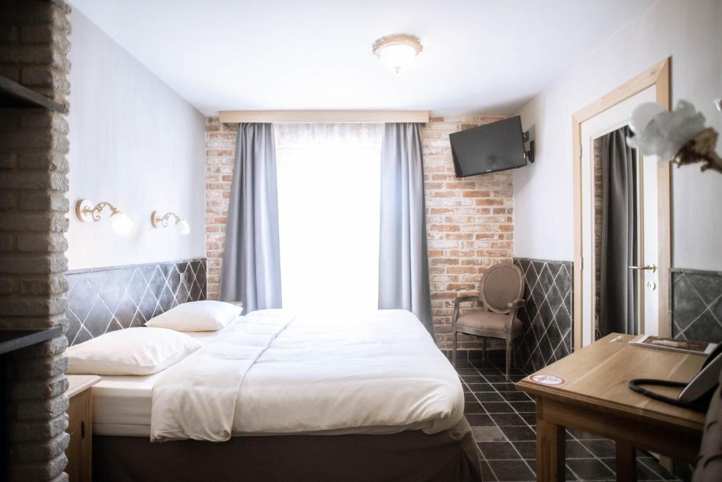 Postel nebo postele na pokoji v ubytování Thermae Boetfort Hotel