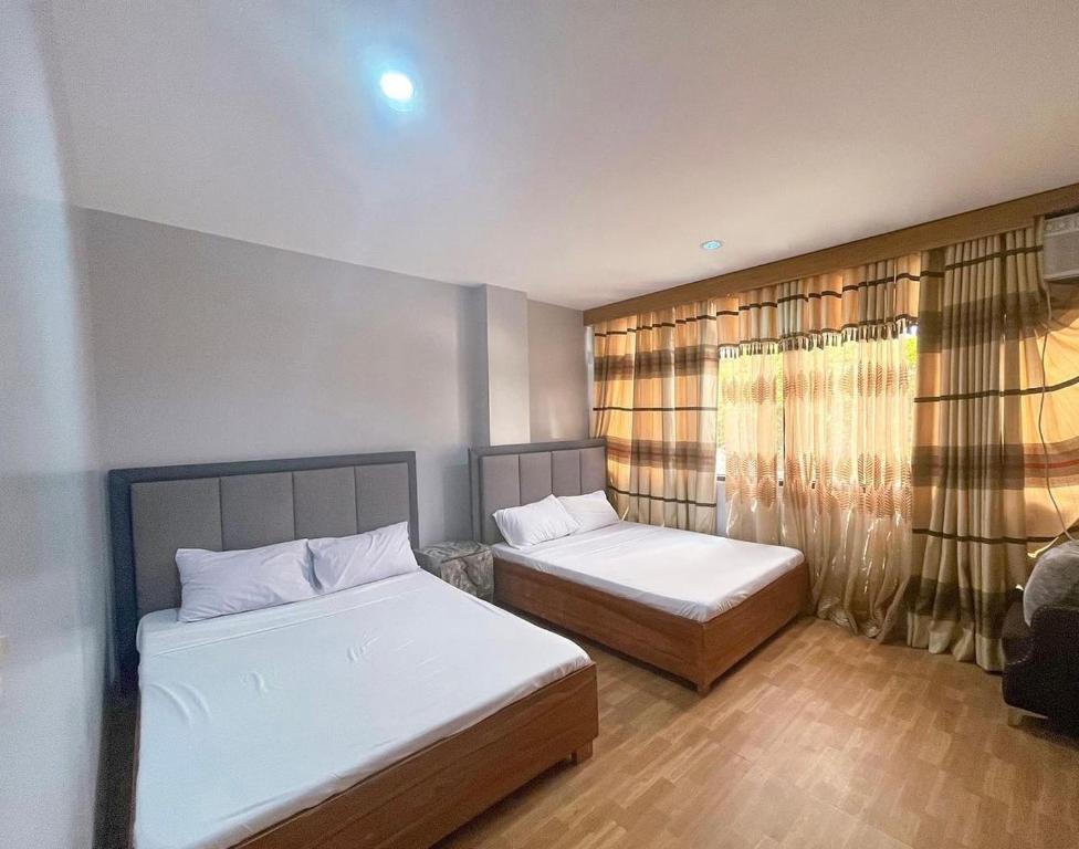 Voodi või voodid majutusasutuse D Square Tagaytay toas
