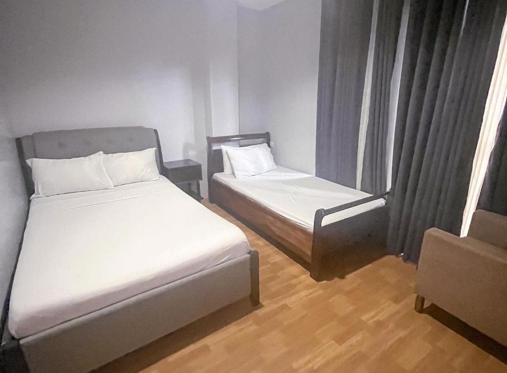 Voodi või voodid majutusasutuse D Square Tagaytay toas