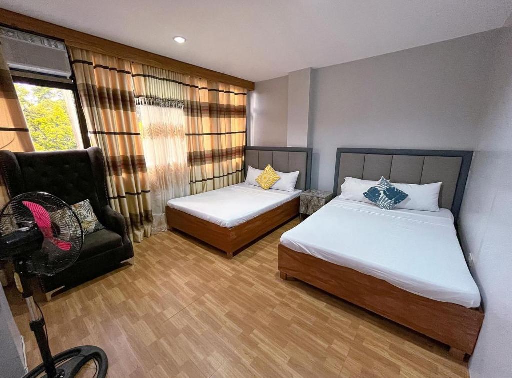 Voodi või voodid majutusasutuse D Square Tagaytay toas