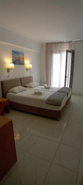 Postel nebo postele na pokoji v ubytování Delfini Hotel