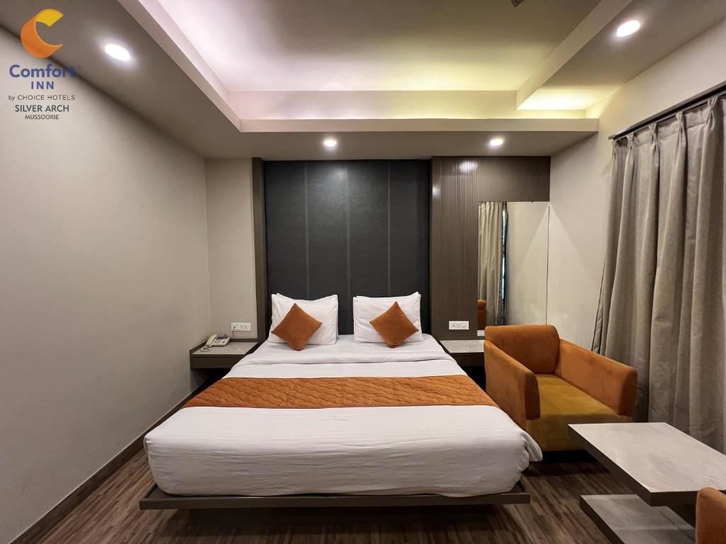 Postel nebo postele na pokoji v ubytování Comfort Inn Silver Arch Hotel, Mussoorie