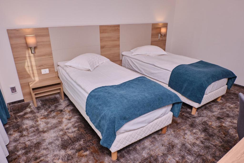 Postel nebo postele na pokoji v ubytování Hotel Regal